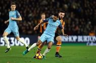 HULL, ENGLAND - DECEMBER 26: Gael Clichy of Manchester City is closed down by Robert Snodgrass of Hull City during the Premier League match between Hull City and Manchester City at KCOM Stadium on December 26, 2016 in Hull, England.  (Photo by Nigel Roddis/Getty Images)